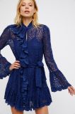 Delicate Sheer Lace Mini Dress Statement Ruffle Detailing Down The Front