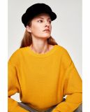 Open Knit Top with a Round Collar and Long Sleeves
